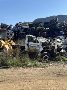 SMASH Cars | Junk Car Removal in a Scrap Metal Yard