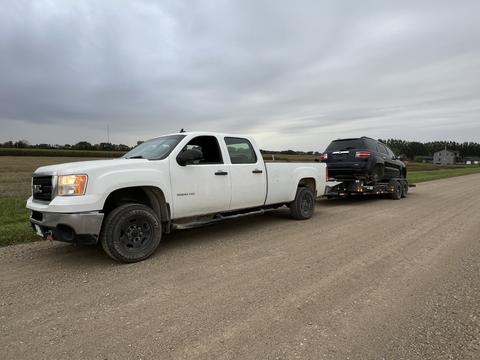 SMASH Cars | GMC Truck Towing Junk Car for Scrap Metal Recycling